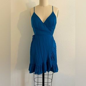 Size M beautiful slightly teal blue TRUE wrap dress. Free People